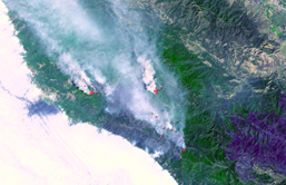 A high altitude aerial view of forest fires in California. 